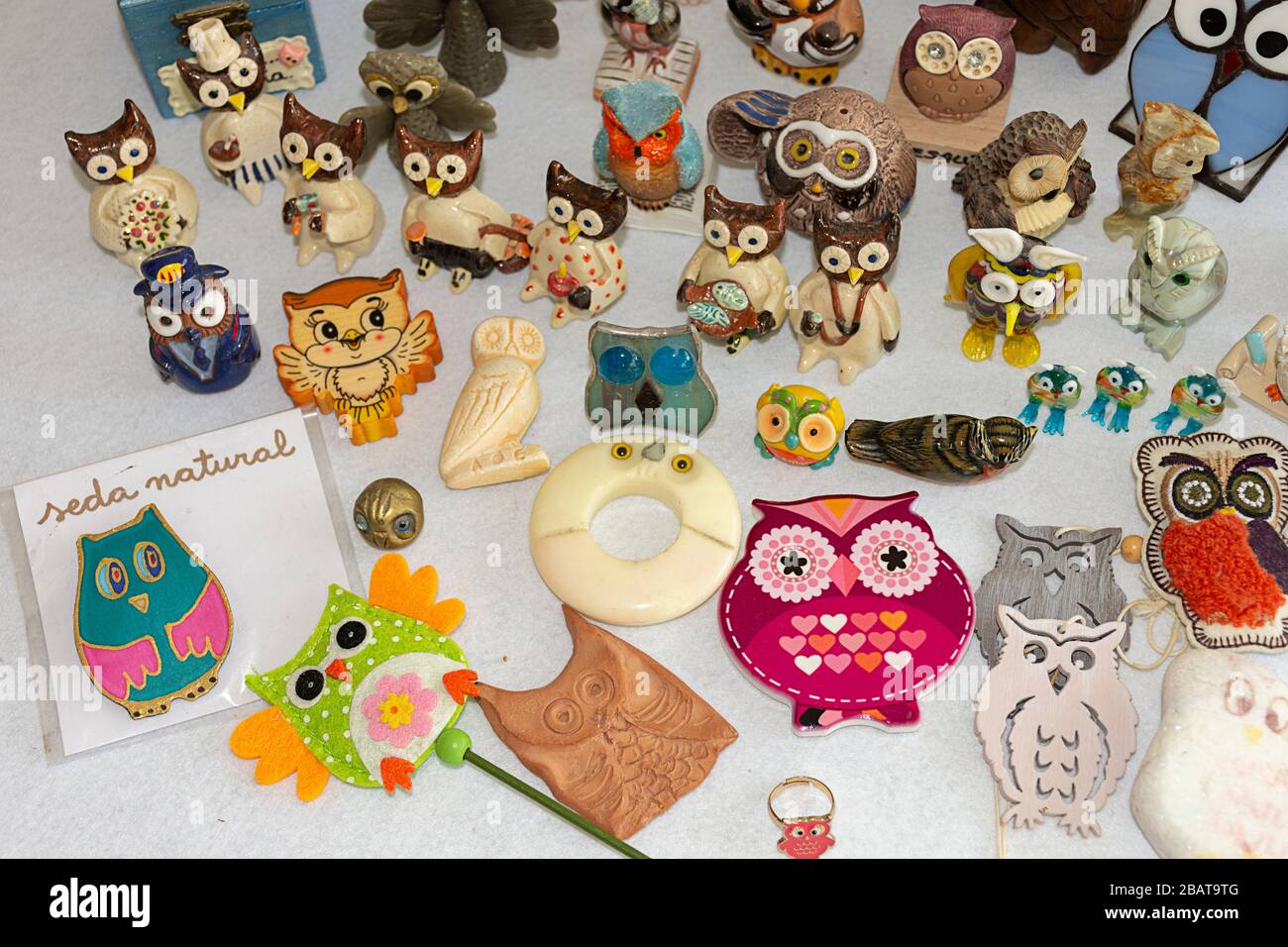 Owl collection. Different materials, shapes, colors and sizes. Souvenirs from the world. Stock Photo