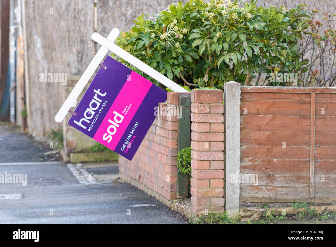 Collapsed property market sold sign during the COVID-19 Coronavirus pandemic outbreak lockdown. Haart estate agent. Concept for collapse of economy Stock Photo