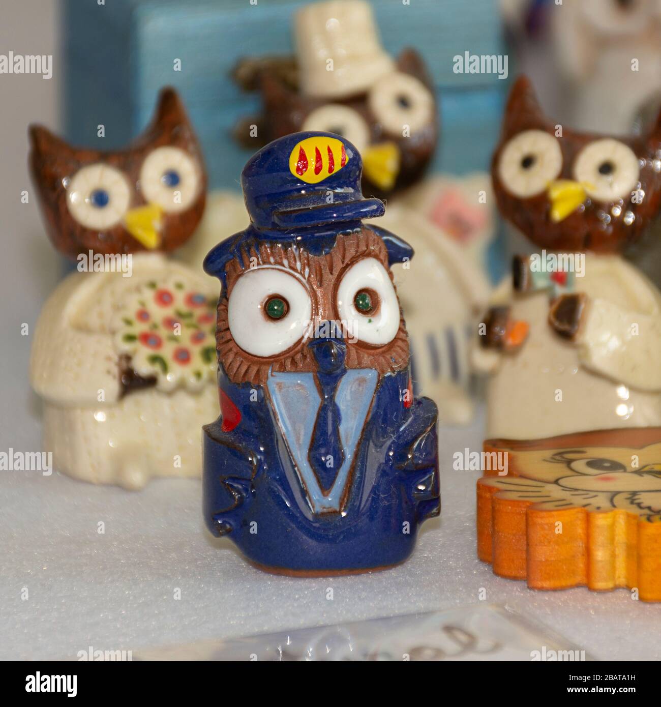 Owl collection. Different materials, shapes, colors and sizes. Souvenirs from the world. Stock Photo