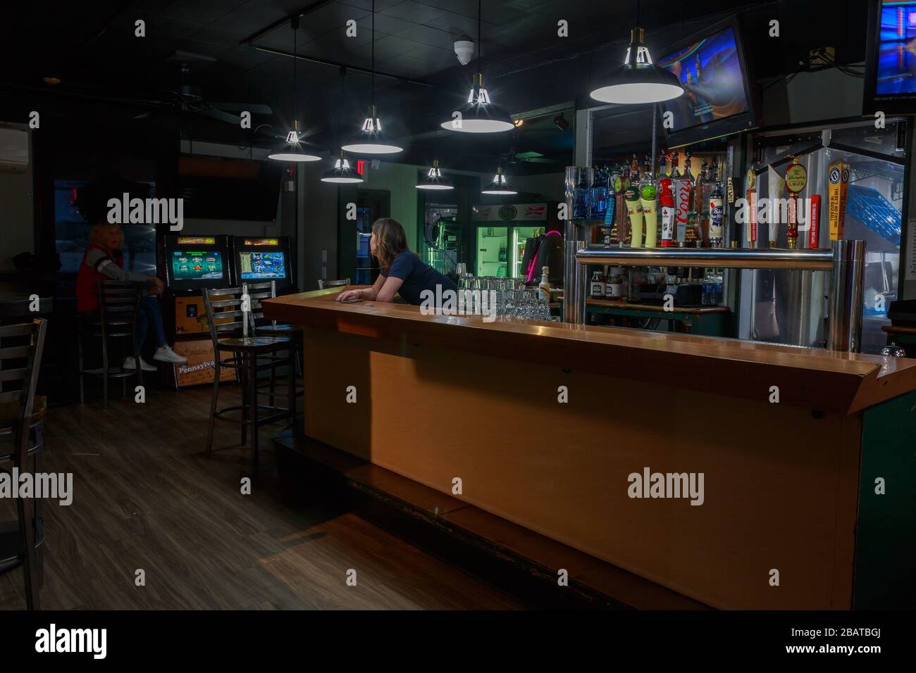 Coronavirus COVID-19, Empty small local bar and restaurant, March 27, 2020, open for beer and take-out only. Stock Photo