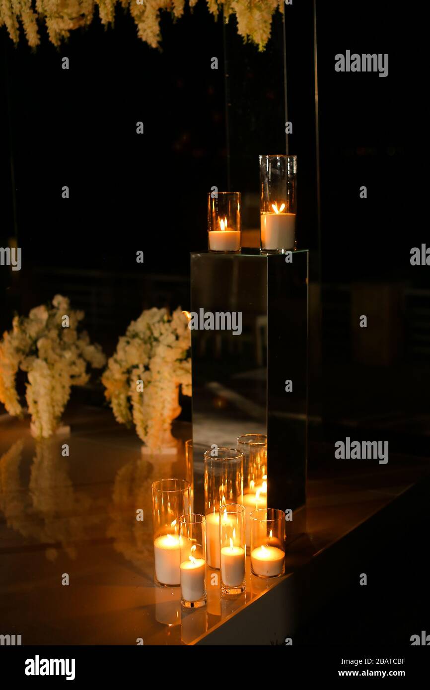 Wedding altar with many burning candes in night. Stock Photo