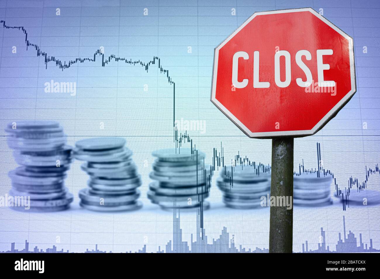 Close sign on economy background - graph and coins. Financial crash in world economy because of coronavirus. Global economic crisis, recession. Stock Photo