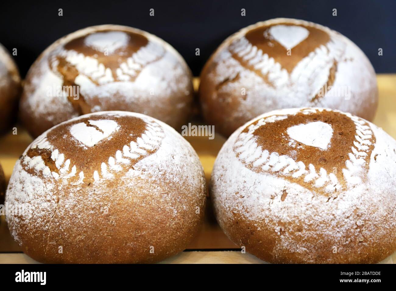 Freshly baked rye and wheat bread sprinkled with flour Stock Photo