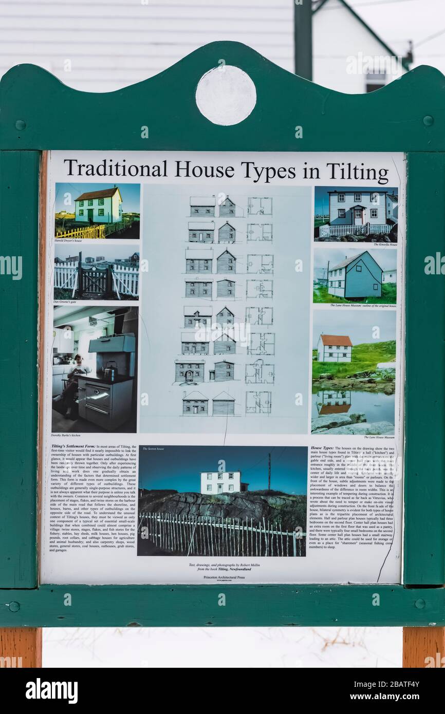 Interpretive sign about houses in the historic fishing village of Tilting, on Fogo Island in Newfoundland, Canada Stock Photo