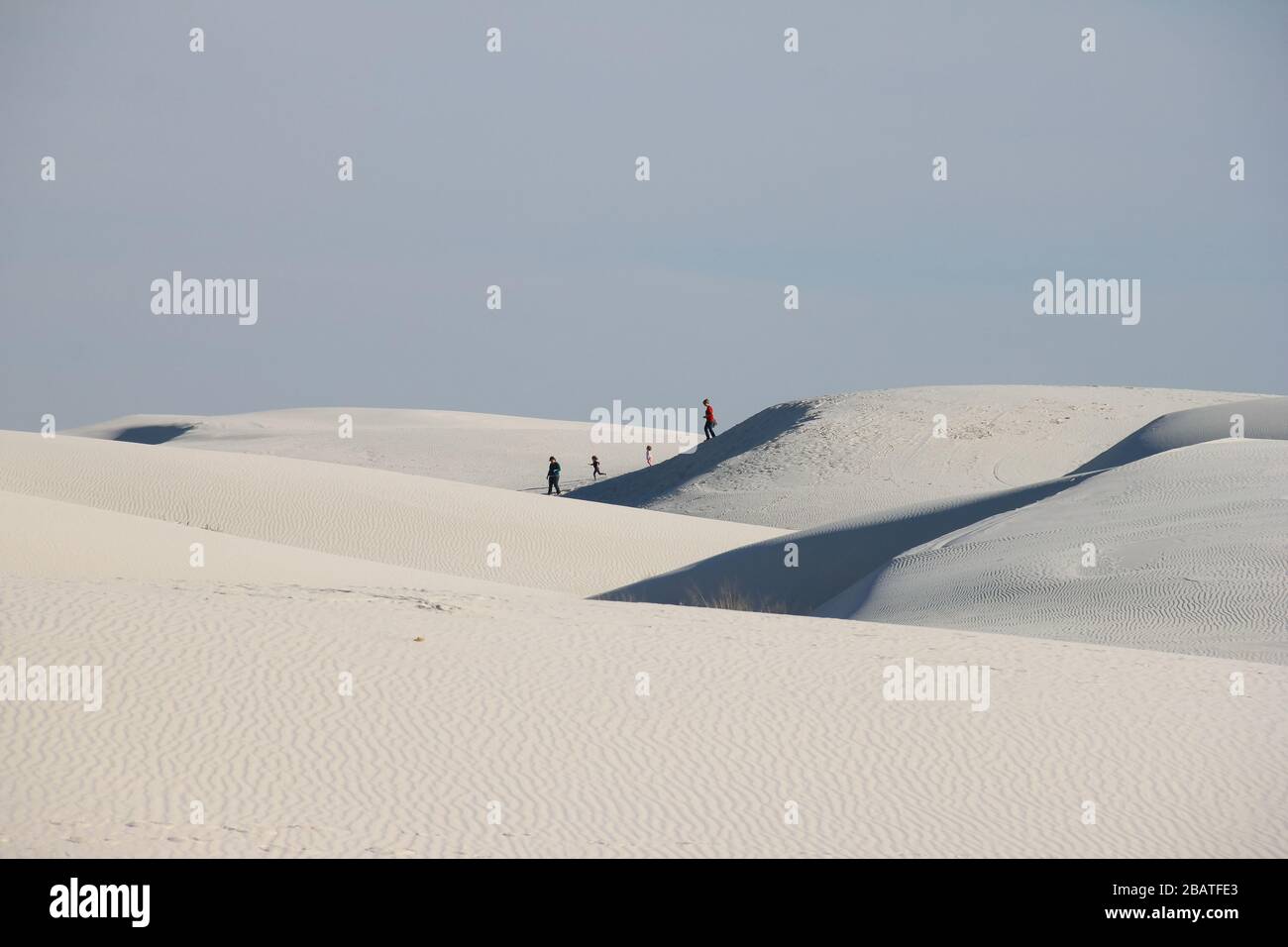 Family Walking at the sand dunes of White Sands National Monument in New Mexico, USA Stock Photo