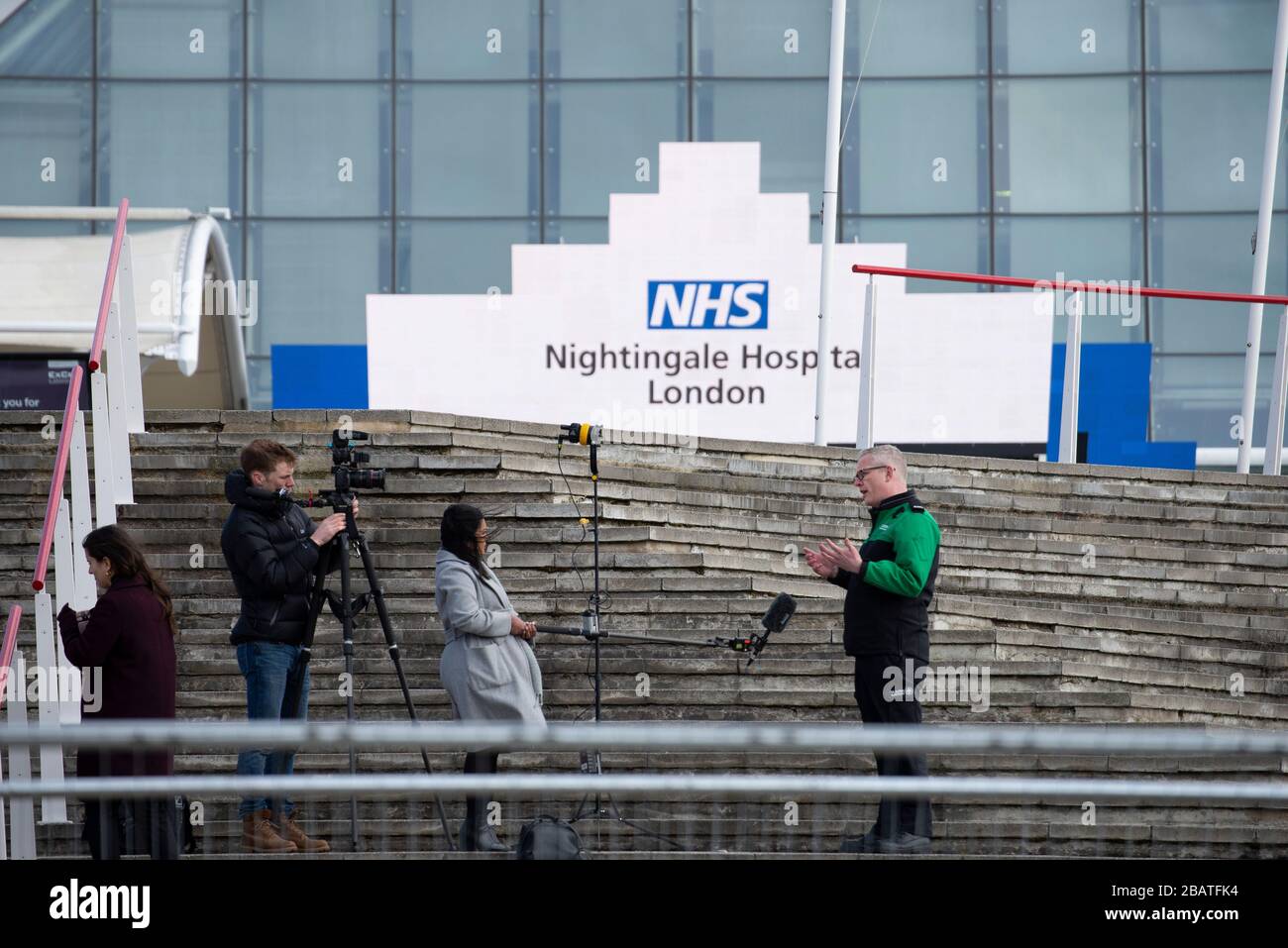 London, UK. 29th Mar, 2020. Media observe social distancing while