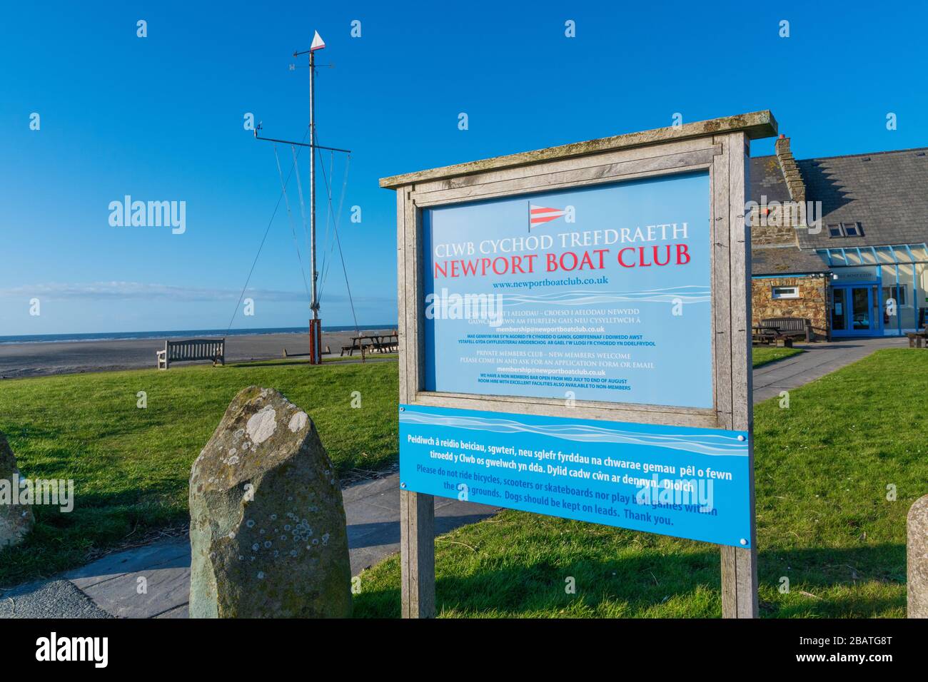 Sign outside Newport Boat Club with nautical flag pole in background