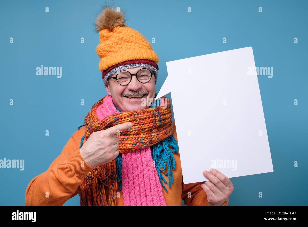Smiling senior man pointing finger on copyspace Stock Photo