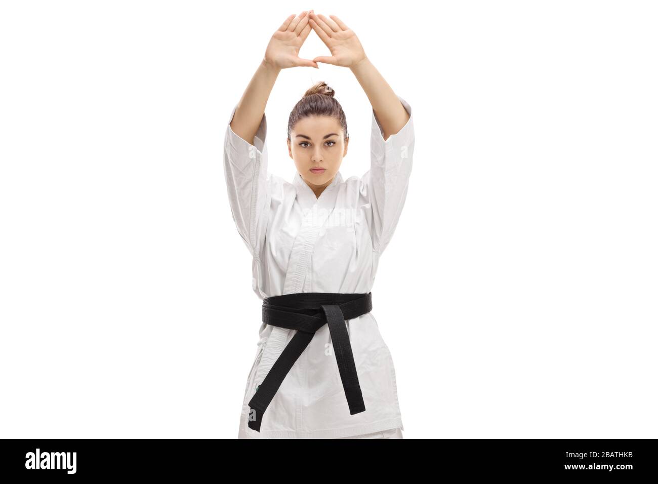 Woman practicing karate isolated on white background Stock Photo
