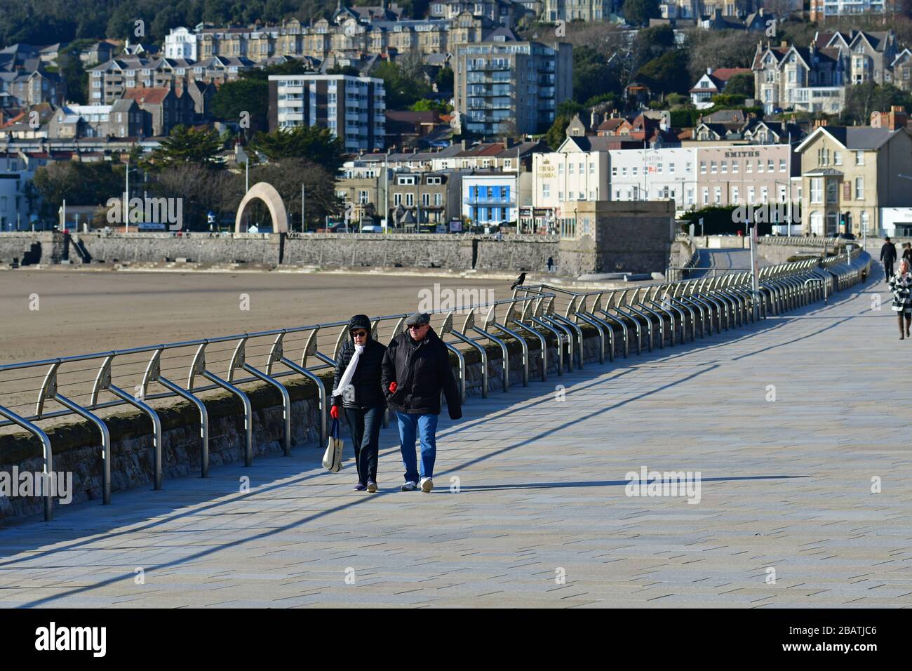 Weston-Super-Mare, North Somerset, UK. 29th Mar, 2020. UK covid-19 virus lockdown.Walkers  on the promenade.World Famous Weston Super Mare seafront with new Government Guide Lines Iminent. Picture credit Robert Timoney/Alamy/Live/News Stock Photo