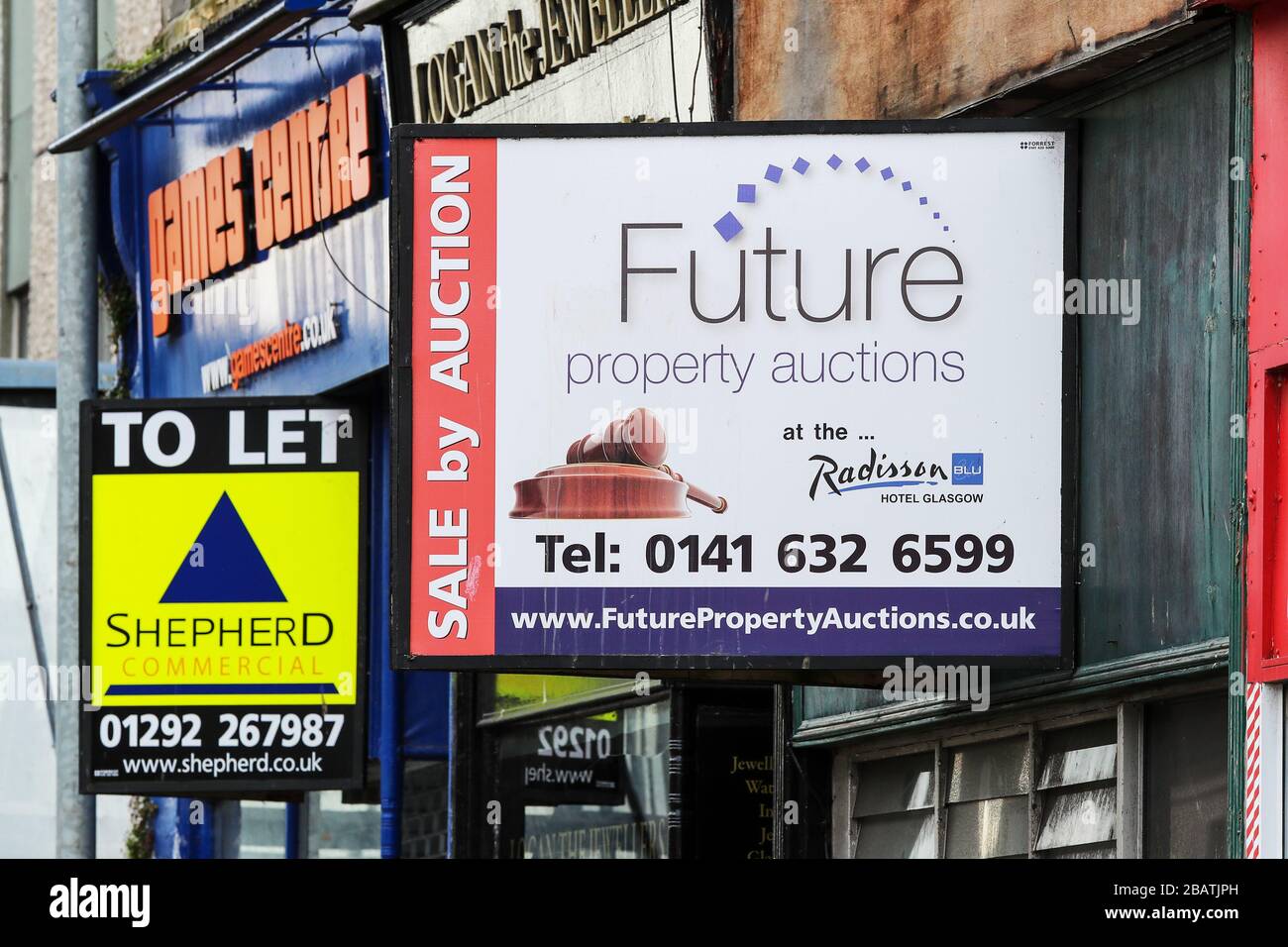 Property sale boarding outside shop premises that have gone out of