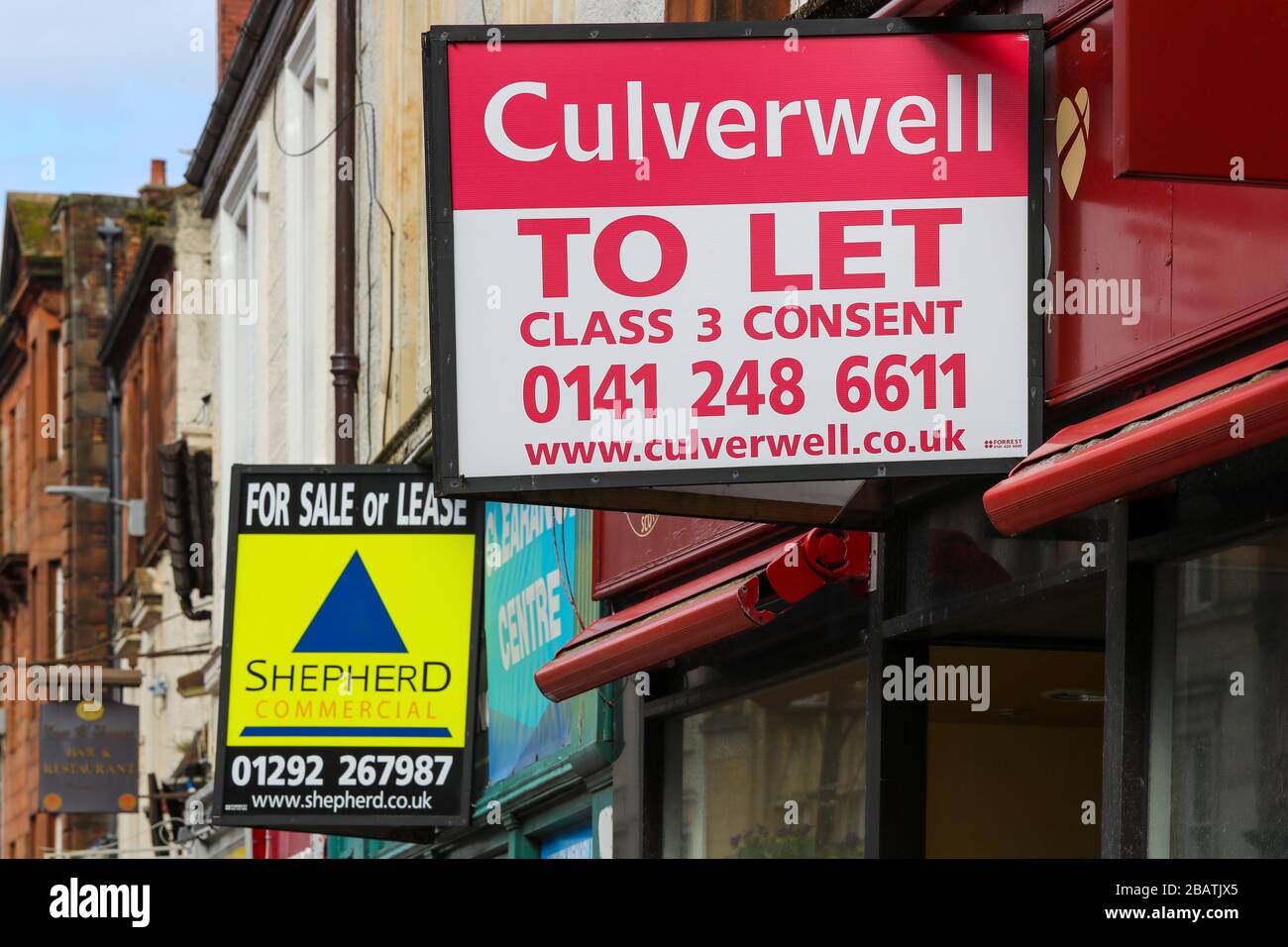 Property sale boarding outside shop premises that have gone out of