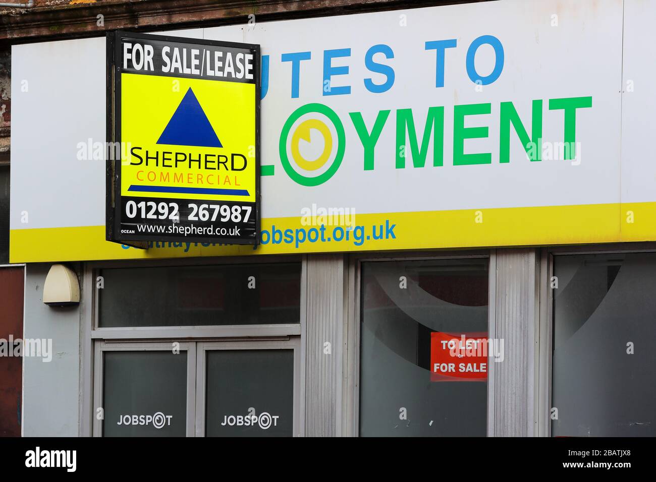 Property sale boarding outside shop premises that have gone out of