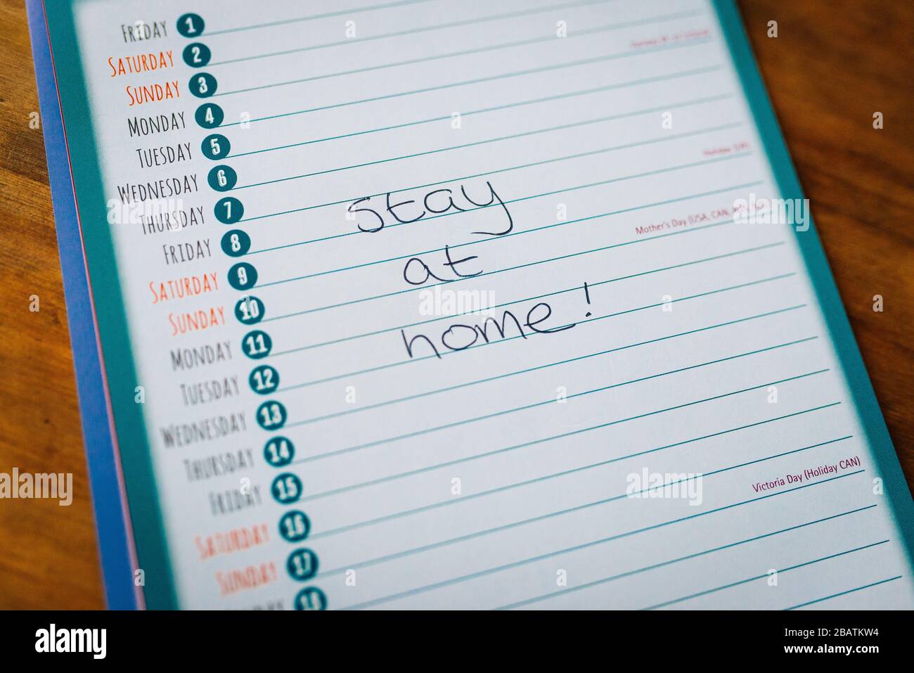 Coronavirus covid19 lockdown quarantine. Stay at home. Calendar showing a blank month with the words 'stay at home' handwritten Stock Photo