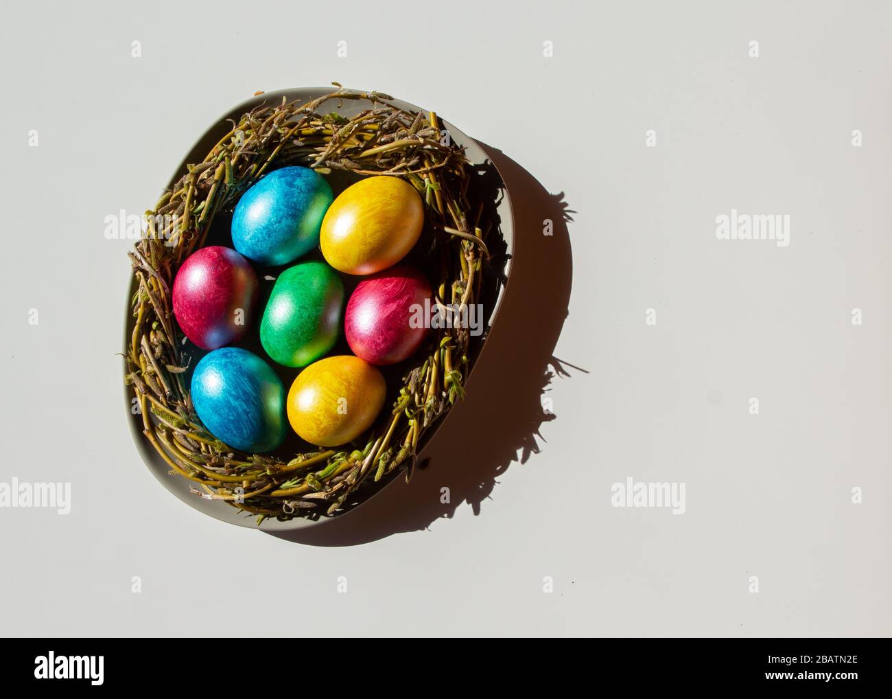 Colorful easter eggs in nest on white background with shadow Stock ...
