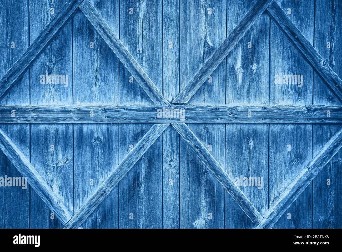 Old wooden door background, color of the year 2020 pantone classic blue 19-4052 Stock Photo