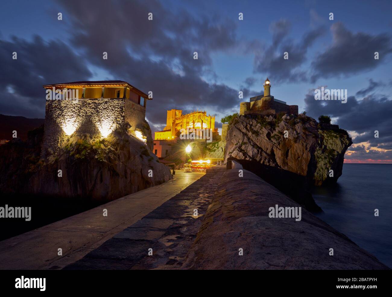 Night photography of the lighthouse of Castro Urdiales and the fisherman port. Cantabria, Spain Stock Photo