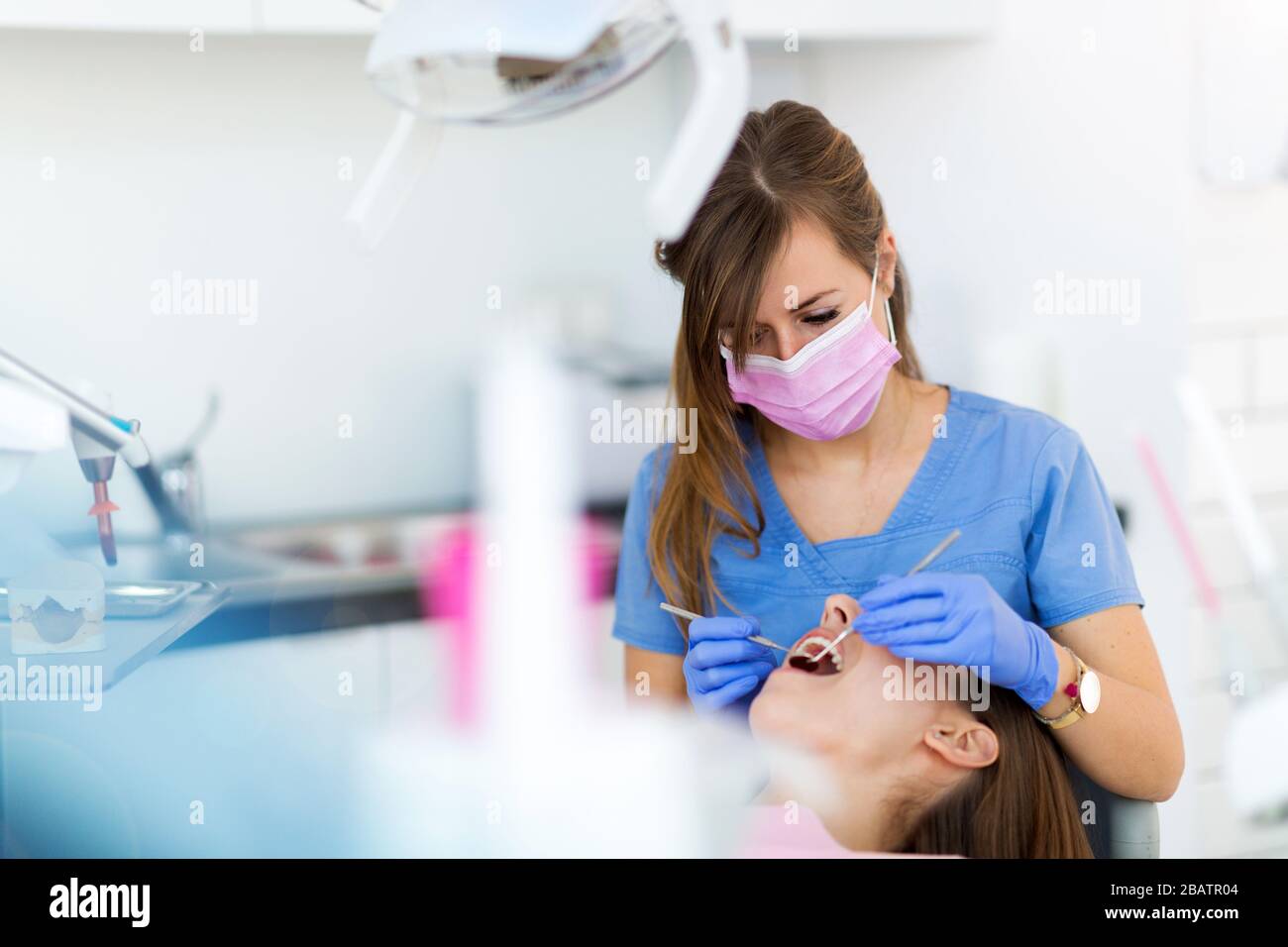 Dentist and patient in dentist office Stock Photo