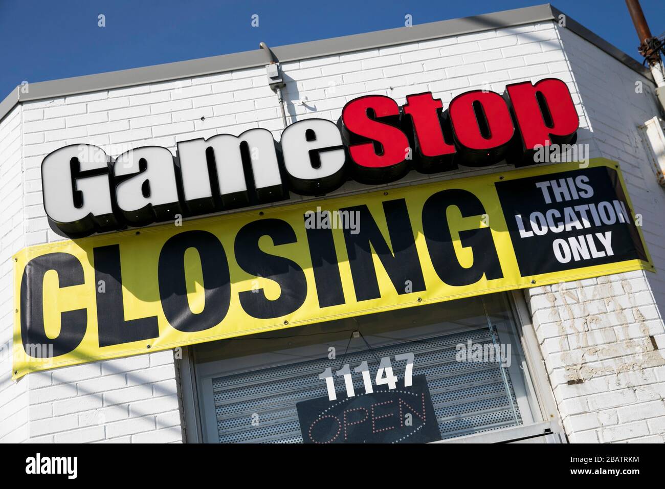 'Store Closing' signs outside of a GameStop retail store location in Wheaton, Maryland on March 26, 2020. Stock Photo