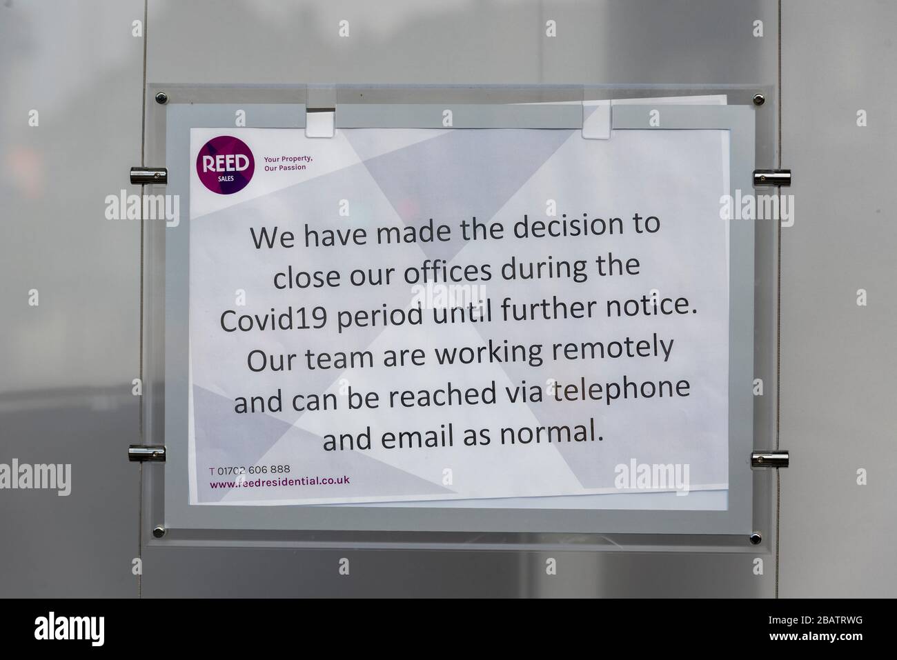 Reed Residential letting and estate agent closed during the COVID-19 Coronavirus pandemic outbreak lockdown. Closed until further notice sign Stock Photo