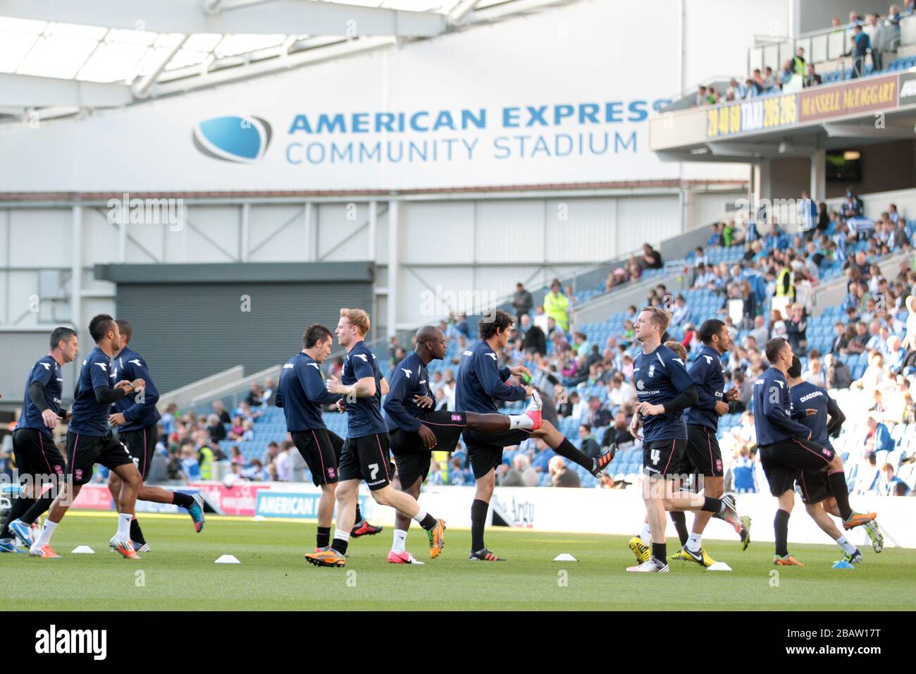 Birmingham City players warm up at the AMEX Stadium Stock Photo