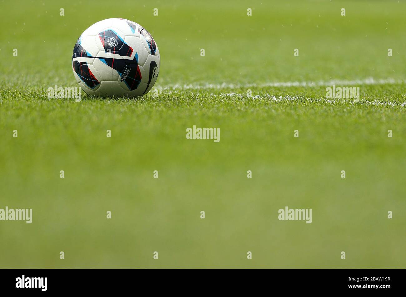 Detail of an official Premier League football on the pitch Stock Photo