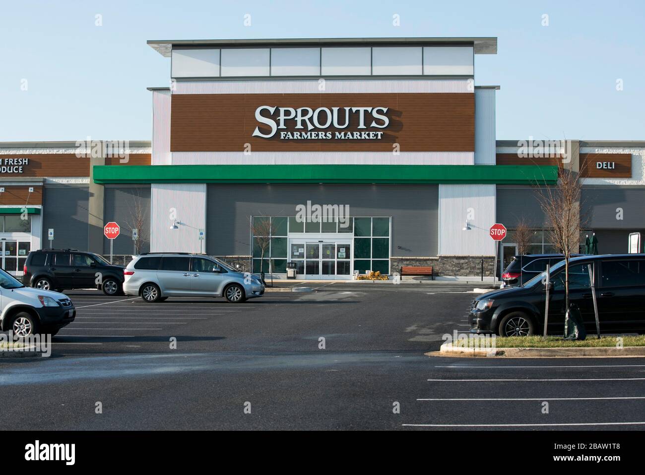 A logo sign outside of a Sprouts Farmers Market retail grocery store