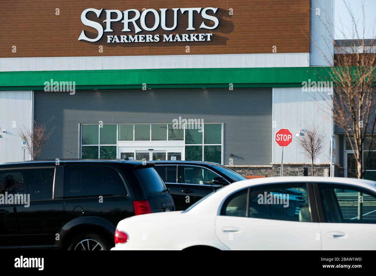 A logo sign outside of a Sprouts Farmers Market retail grocery store