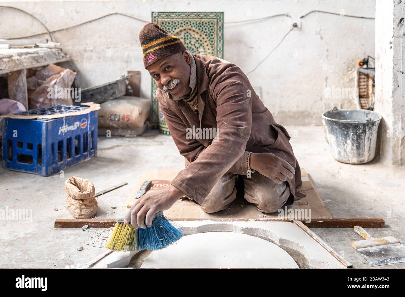 A potter makes ceramic pots at Art Naji pottery factory, Fes, Morocco