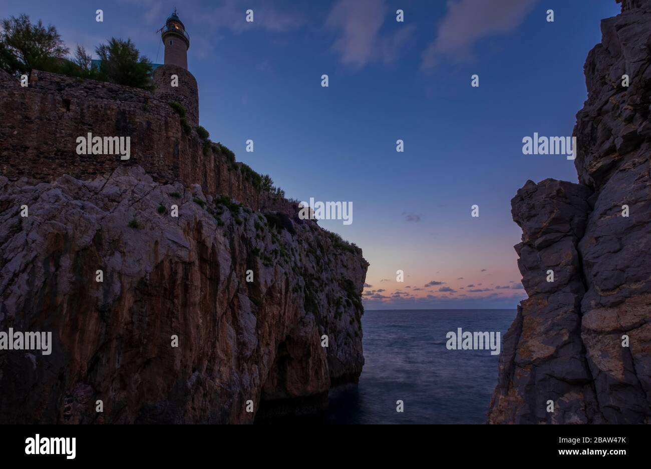 Night photography of the lighthouse of Castro Urdiales and the fisherman port. Cantabria, Spain Stock Photo