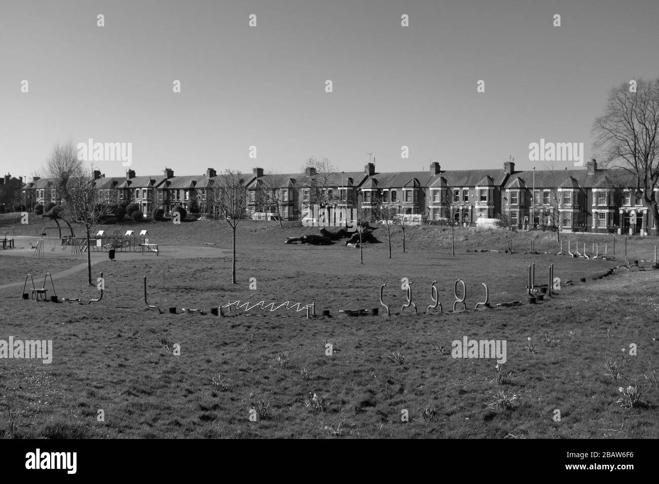 Derby Park in Bootle Liverpool is almost deserted and the children's play area closed. People keep their distance at the supermarket due to COVID-19. Stock Photo