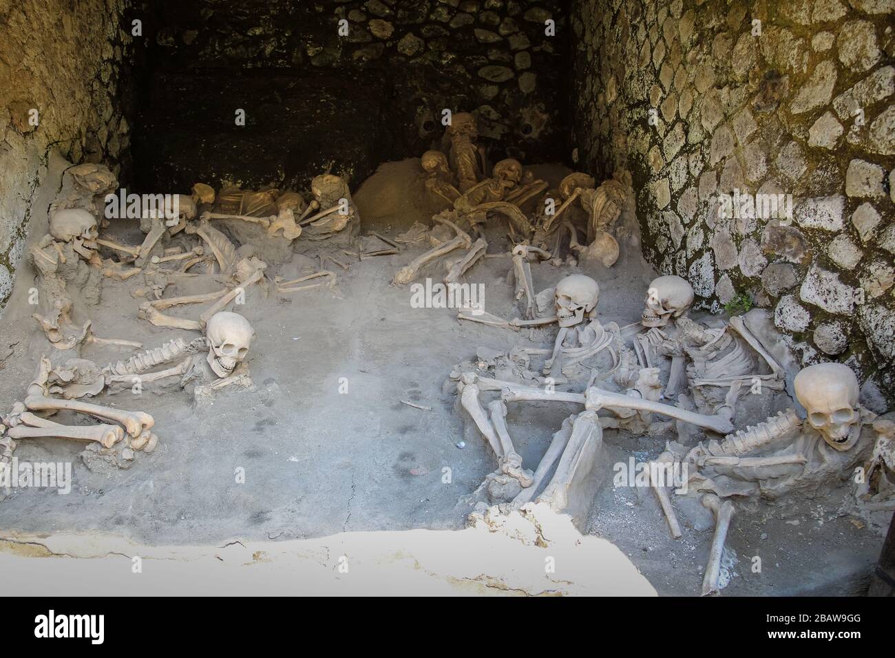 Replica skeletons in the position that the bodies were found after volcanic flow in 79AD Herculaneum Ercolana Campania Italy Stock Photo