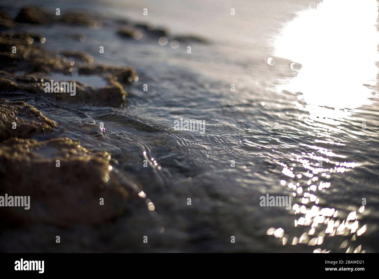 Beautiful rocky sea beach sunset hi-res stock photography and images ...