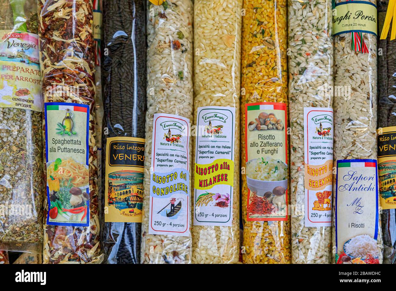 Venice, Italy - September 24, 2017: Food souvenir selection of prepackaged bags of rice for risotto with different flavors at a venetian market Stock Photo