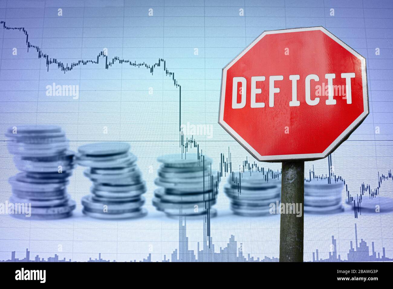 Deficit sign on economy background - graph and coins. Financial crash in world economy because of coronavirus. Global economic crisis, recession. Stock Photo