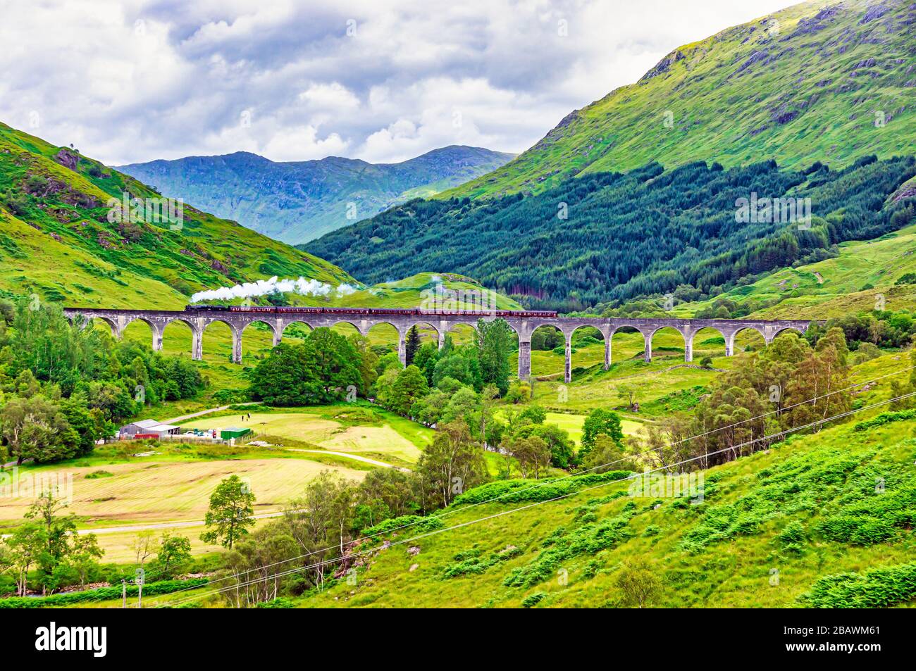 West Coast Railways operated Jacobite steam train crossing the Glenfinnan Viaduct en route to Mallaig from Fort William in Highland Scotland Stock Photo