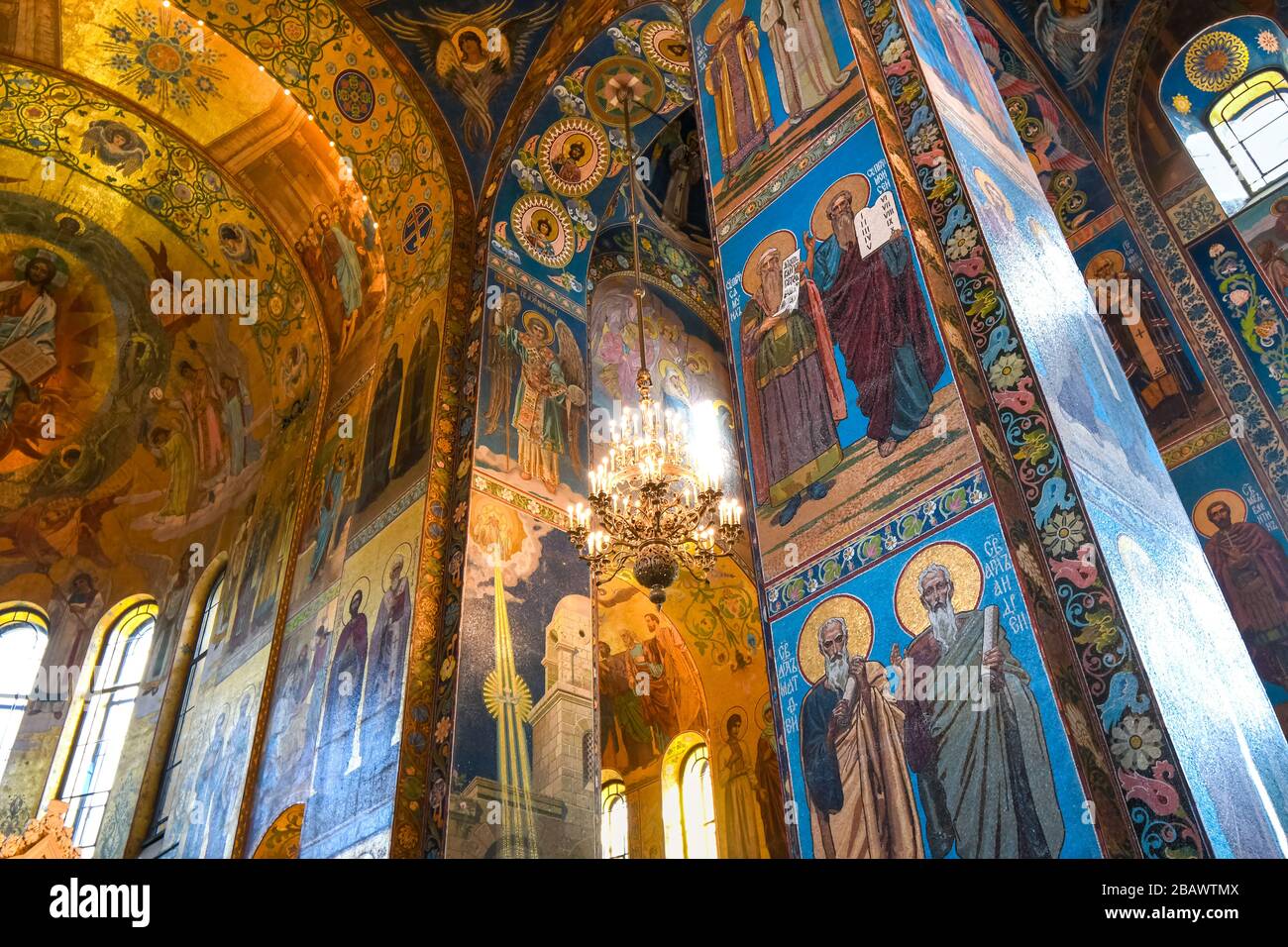 The ceiling, columns and walls covered in mosaics depicting religious scenes inside the Church of Our Savior on Spilled Blood, Saint Petersburg Russia Stock Photo