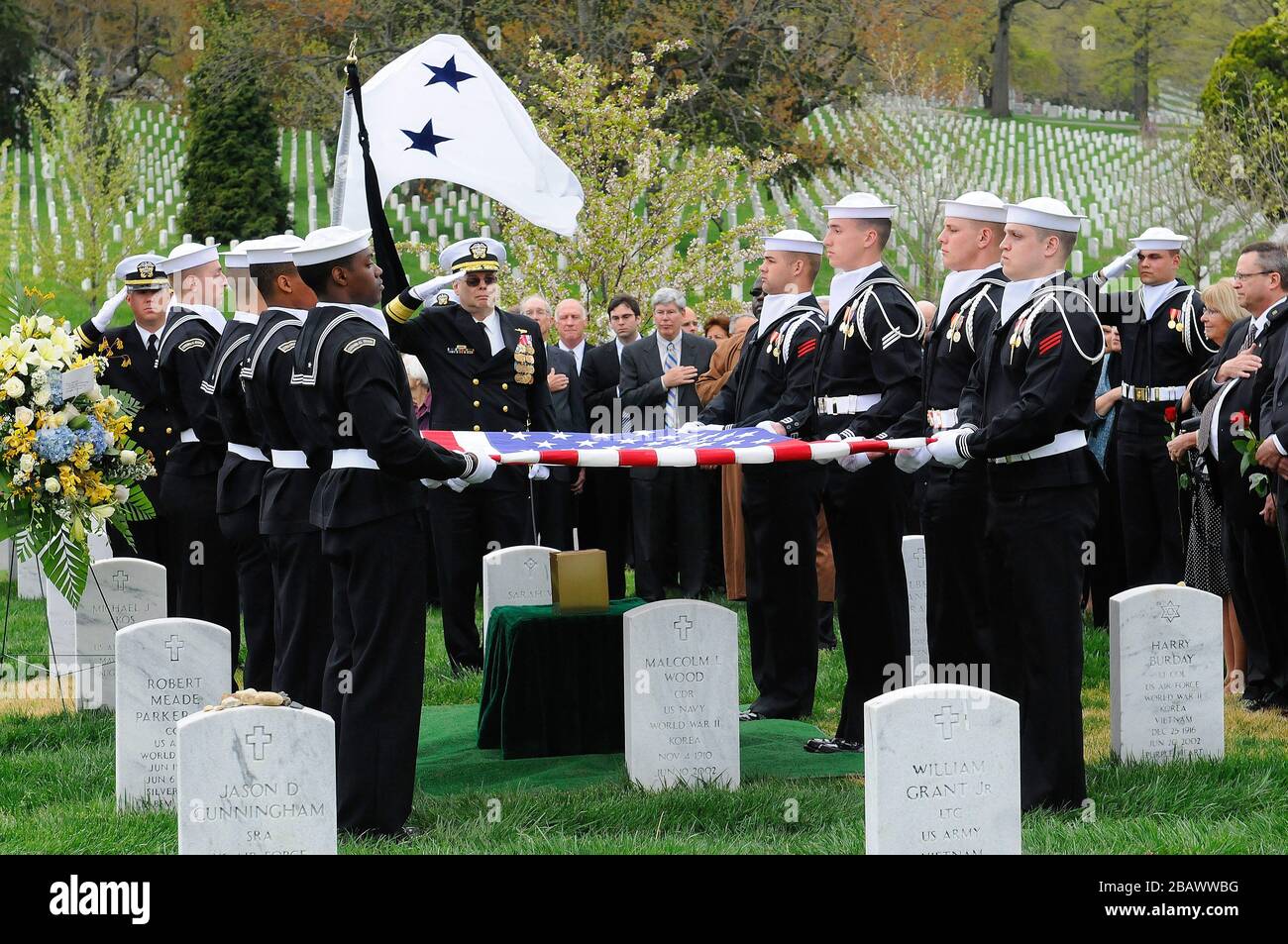 Rear Adm. Samuel J. Cox, commander of the Office of Naval Intelligence, renders a final salute to Rear Adm. Donald 'Mac' Showers during Showers' funeral at Arlington National Cemetery. Showers served 42 years in the intelligence community as a naval officer and later as a civilian. He began his career as an ensign assigned to the code breaking team whose success led to the victory over the Japanese navy at the Battle of Midway in World War II. (U.S. Navy photo by Russ Carter/Released) Stock Photo