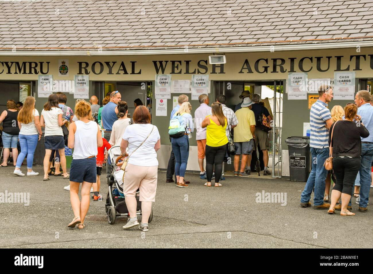 BUILTH WELLS, WALES - JULY 2018: People queuing outside ticket office at the Royal Welsh Showground in Builth Wells. Stock Photo