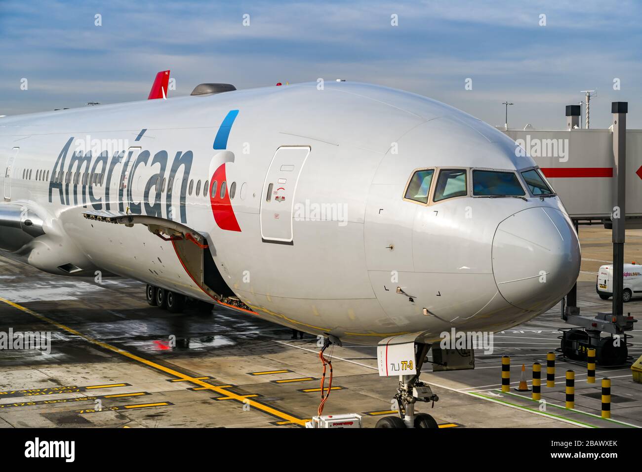 LONDON, ENGLAND - NOVEMBER 2018: American Airlines Boeing 777 long haul airliner parked at Terminal 3 at London Heathrow Airport. Stock Photo