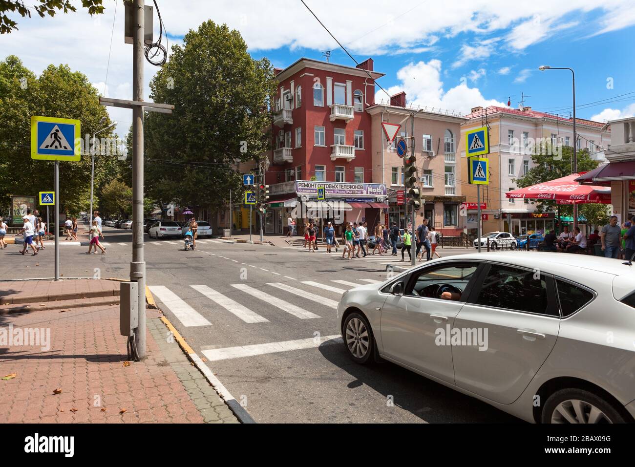 TUAPSE, RUSSIA-CIRCA JUL, 2018: Crossroad with traffic light of Karl Marx and Mira streets is in center of town. It is one of the beautiful and pictur Stock Photo