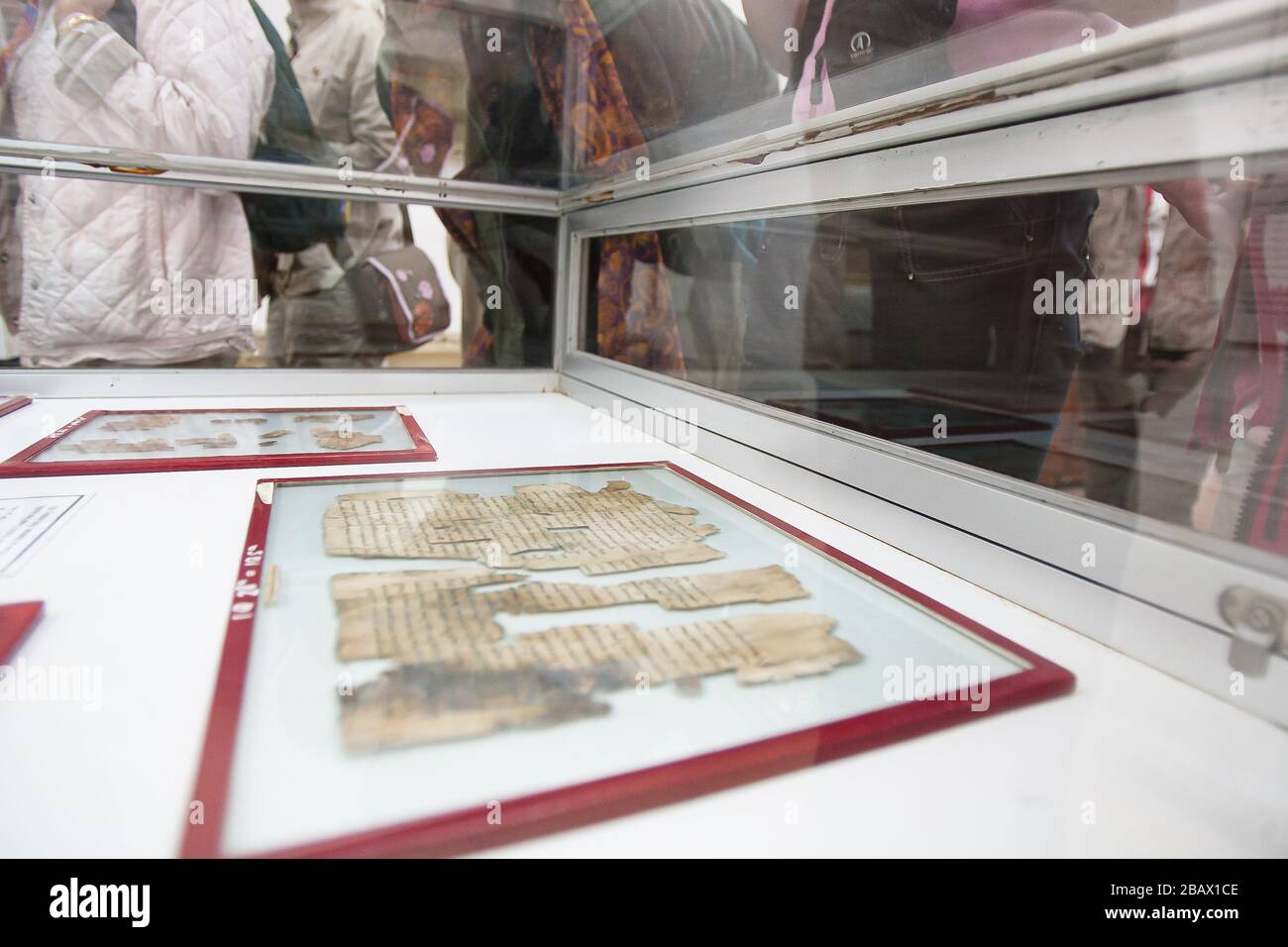 Amman, Jordan, May 3, 2009: The Dead Sea Scrolls (The Qumran Caves Scrolls) on display in the Jordan Archeological Museum in the Amman Citadel in 2009 Stock Photo