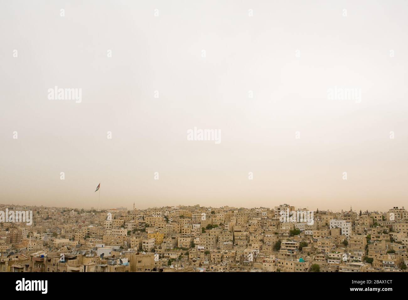 The densely populated area of the old city of Amman, Jordan, and the Raghadan Flagpole, one of the tallest free-standing flagpoles in the world. Stock Photo