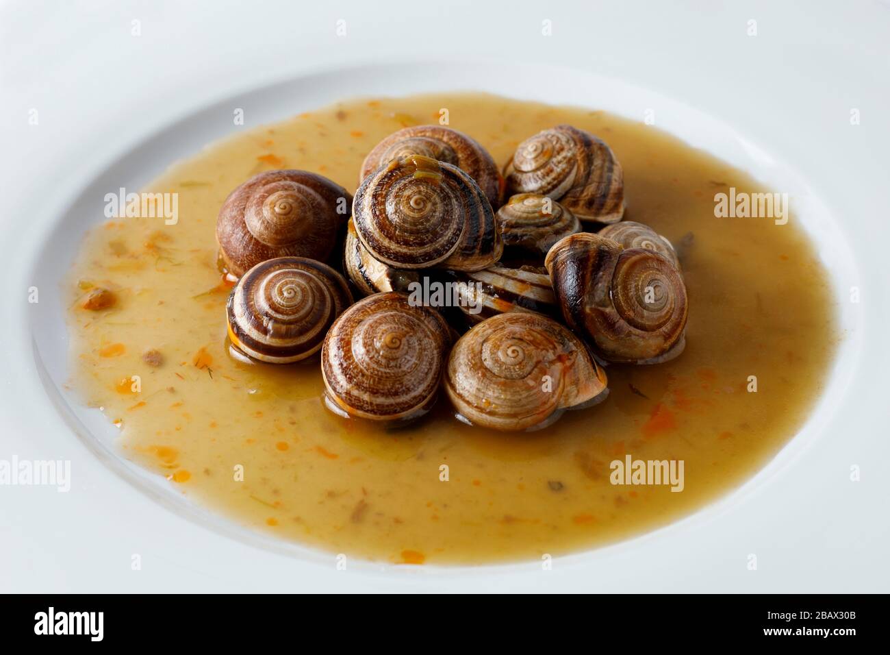 Snails with garlic and parsley Stock Photo Alamy