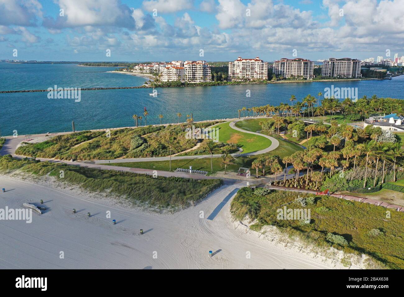 South Pointe Park in Miami Beach, Florida devoid of people during  coronavirus pandemic beach and park closures with Fisher Island in  background Stock Photo - Alamy