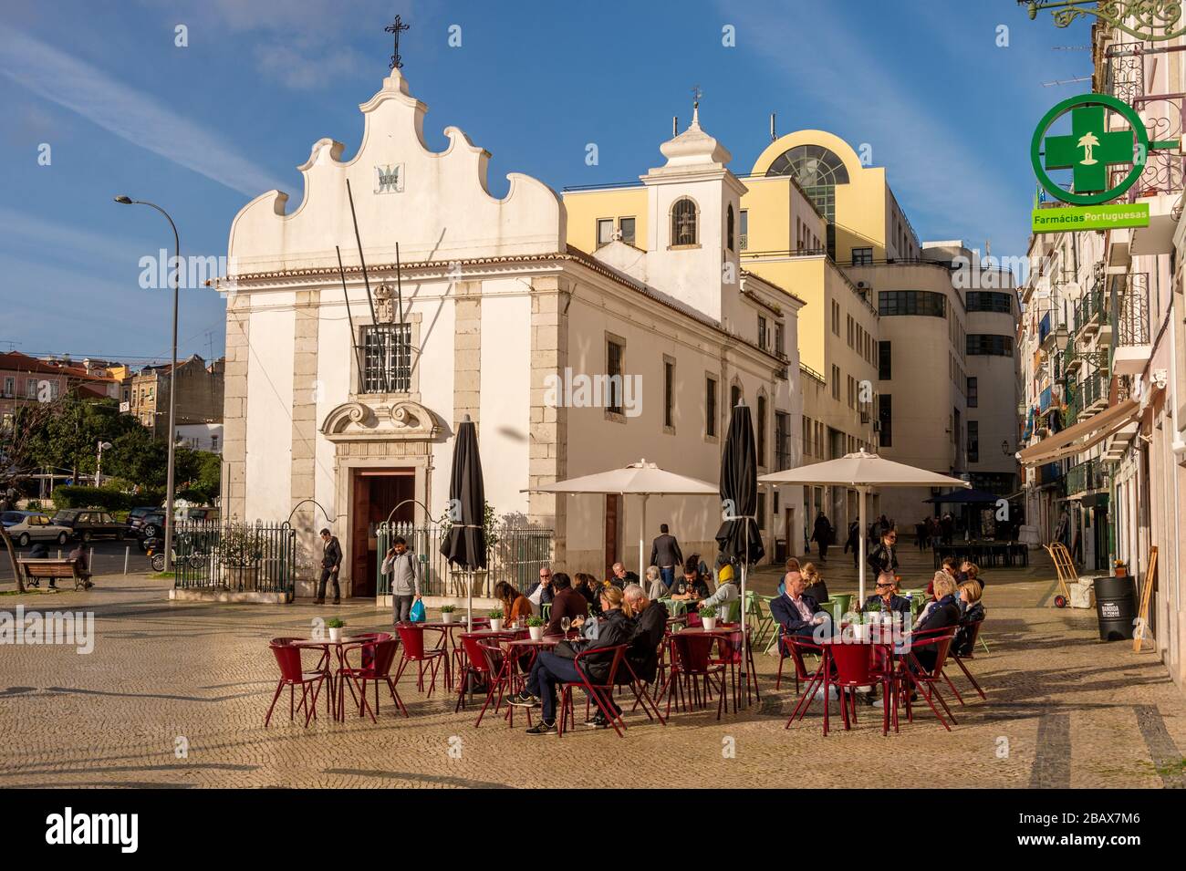Lisbon, Portugal - 2 March 2020: People having a drink at a cafe terrace at the Praca dom Duarte Stock Photo