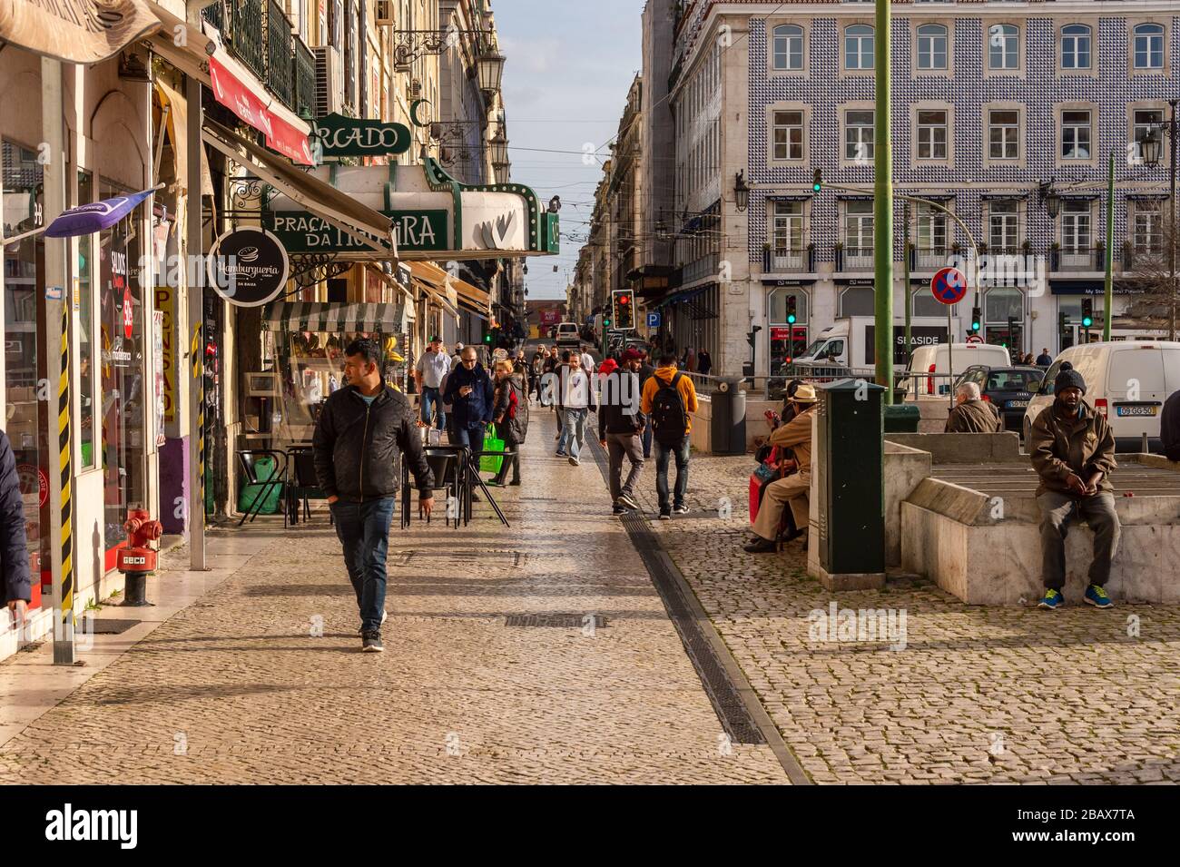 Lisbon, Portugal - 2 March 2020: Pedestrians walking at the Praca da Figueira Stock Photo