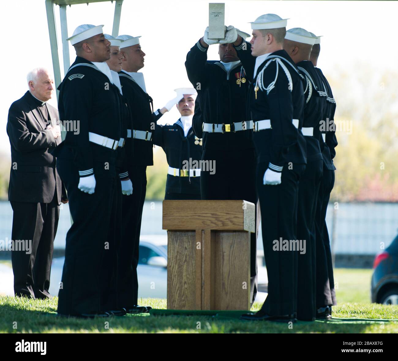 "Sailors participate in the graveside service for U.S. Navy Petty Officer 3rd Class Charles Thomas Dougherty in Arlington National Cemetery, April 18, 2016, in Arlington, Va. Dougherty was inurned in ANC’s Columbarium Court 9. (U.S. Army photo Rachel Larue/Arlington National Cemetery/Rachel Larue); 18 April 2016, 09:10; Graveside Service for U.S. Navy Petty Officer 3rd Class Charles Thomas Dougherty in Arlington National Cemetery; Arlington National Cemetery; " Stock Photo