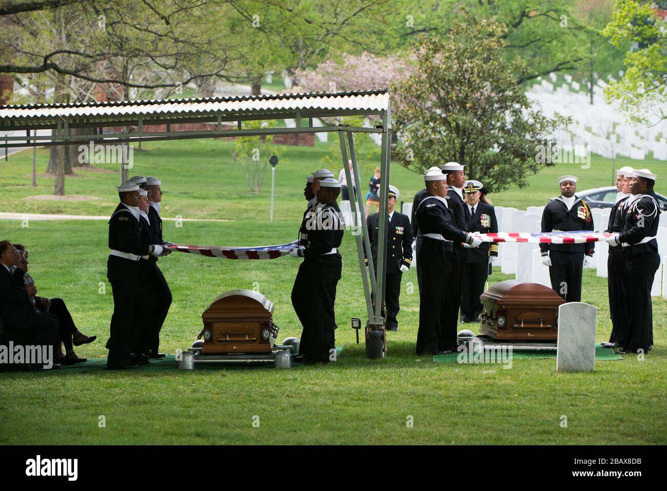 "U.S. Navy sailors participate in the graveside service for Capt. Arthur F. Rawson and his wife Lt. Junior Grade Patricia O. Rawson, April 21, 2016, in Arlington, Va. Both Arthur and Patricia served in the U.S. Navy and were buried together, at the same service, in Arlington National Cemetery. (U.S. Army photo by Rachel Larue/Arlington National Cemetery/released); 21 April 2016, 14:08; Graveside service for U.S. Navy Capt. Arthur F. Rawson and his wife Lt. Junior Grade Patricia O. Rawson in Arlington National Cemetery; Arlington National Cemetery; " Stock Photo