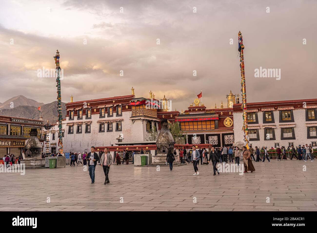 'English: Jokhang on 28 May 2019 The Jokhang  Temple, Jokhang Monastery is a Buddhist temple in Barkhor Square in Lhasa, the capital city of Tibet. Tibetans, in general, consider this temple as the most sacred and important temple in Tibet. The temple is currently maintained by the Gelug school, but they accept worshipers from all sects of Buddhism. The temple's architectural style is a mixture of Indian vihara design, Tibetan and Nepalese design.   During the Cultural Revolution, Red Guards attacked the Jokhang temple in 1966 and for a decade there was no worship. Renovation of the Jokhang to Stock Photo